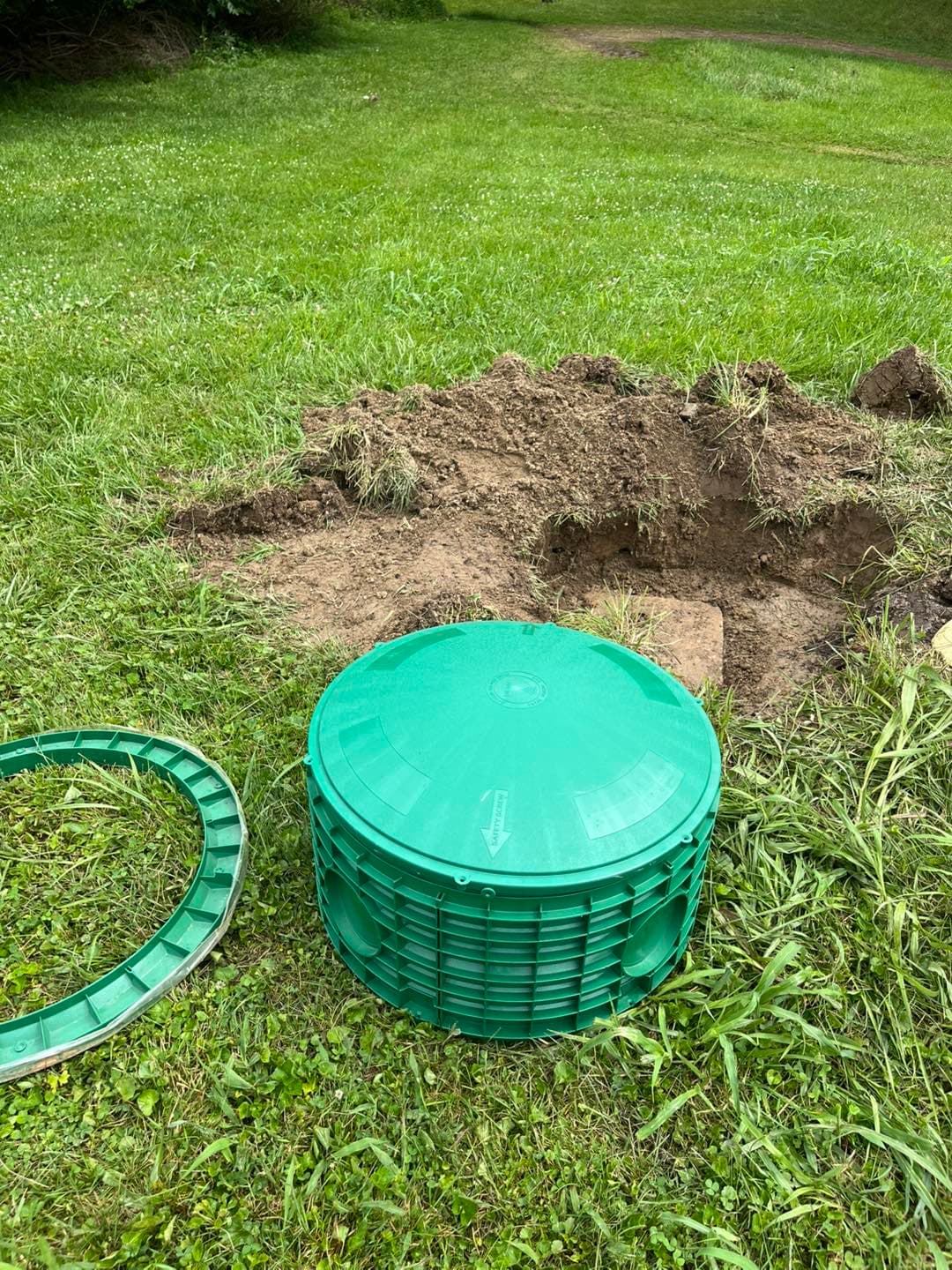 Completed green riser installation in a residential yard
